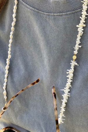 White glasses chain made of shells and bamboo beads